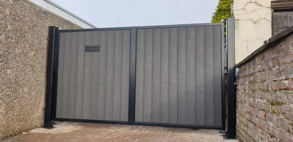 Closed grey double swing driveway gates